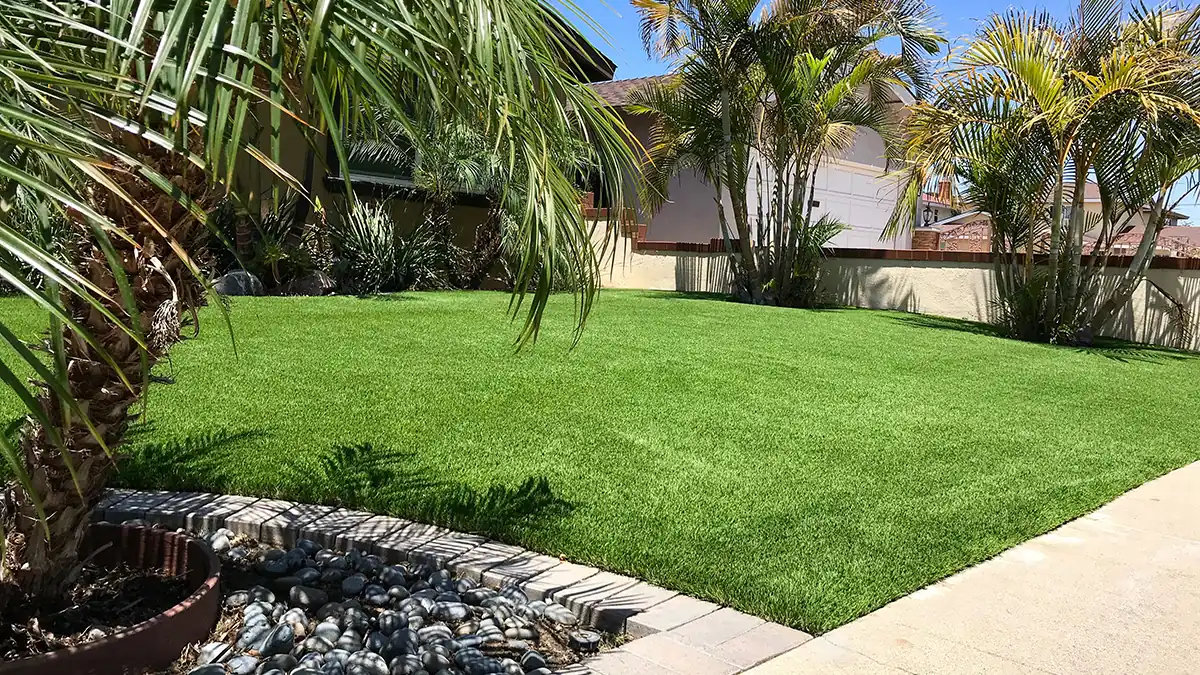The same front yard after: lush artificial grass installed by Scott’s Artificial Grass